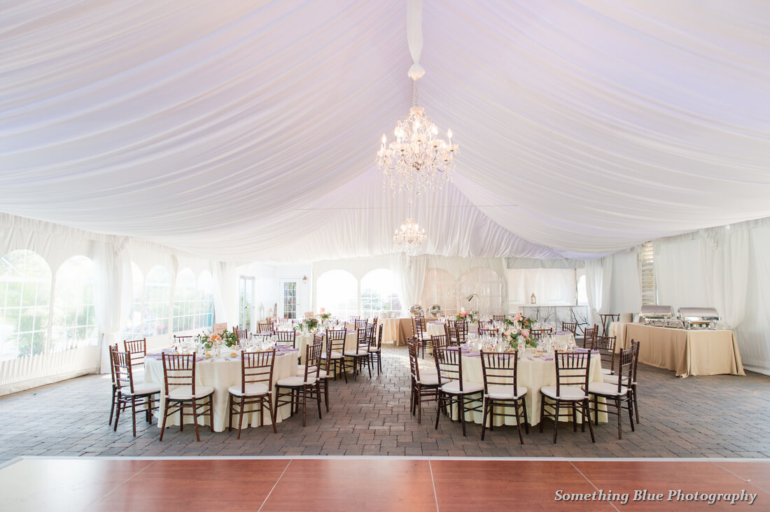 white tent wedding reception area