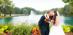 kissing by lake and flowers